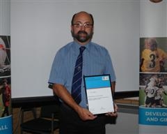 Paul proudly displaying his certificate